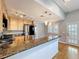 Open kitchen with granite counters, stainless steel appliances, and a breakfast bar at 1122 Vassar St, Orlando, FL 32804