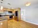 Well-lit kitchen featuring stainless steel appliances, natural wood cabinets and a tile backsplash at 1122 Vassar St, Orlando, FL 32804
