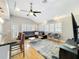 Open-concept living room with modern furnishings, hardwood floors, and bright lighting at 1122 Vassar St, Orlando, FL 32804