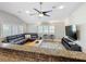 Living room features a modern, leather sectional couch, two accent chairs, and vaulted ceilings at 1122 Vassar St, Orlando, FL 32804