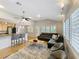 Open-concept living space with kitchen, modern furnishings, and hardwood floors at 1122 Vassar St, Orlando, FL 32804
