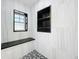 A tiled shower features a window and built-in shelving at 1122 Vassar St, Orlando, FL 32804