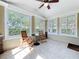 Bright sunroom with tile floor, ceiling fan, and lots of natural light from the many windows at 1122 Vassar St, Orlando, FL 32804