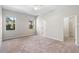 Light-filled bedroom with plush carpeting, two large windows, and ample closet space at 1151 Chessington Cir, Lake Mary, FL 32746