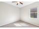 This bedroom offers neutral walls, carpet flooring, and a window at 1151 Chessington Cir, Lake Mary, FL 32746