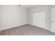This bedroom offers neutral walls, carpet flooring, and a double door closet at 1151 Chessington Cir, Lake Mary, FL 32746