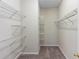 Well-organized walk-in closet with metal shelving offers optimal storage and functionality at 1151 Chessington Cir, Lake Mary, FL 32746