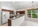 Modern kitchen featuring dark cabinets, gray countertops, and essential appliances at 1151 Chessington Cir, Lake Mary, FL 32746