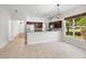 Open-concept kitchen featuring ample counter space and a seamless flow into the dining area at 1151 Chessington Cir, Lake Mary, FL 32746