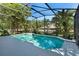 Inviting screened-in pool surrounded by lush landscaping, creating a private outdoor oasis at 1151 Chessington Cir, Lake Mary, FL 32746