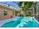 Sparkling pool within screened enclosure, complemented by manicured landscaping, offers the perfect relaxation spot at 1151 Chessington Cir, Lake Mary, FL 32746