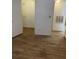 View into a closet space off a room with wood-look flooring at 11520 Westwood Blvd # 515, Orlando, FL 32821