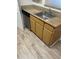 Kitchen with wood cabinets, laminate countertops, stainless steel sink, and a dishwasher at 11520 Westwood Blvd # 515, Orlando, FL 32821
