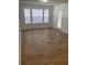 Sunlit living room with luxury vinyl plank flooring and bright light at 11520 Westwood Blvd # 515, Orlando, FL 32821