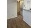 Living area with hard wood flooring and views to the bathroom and kitchen at 11520 Westwood Blvd # 515, Orlando, FL 32821