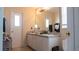 Bathroom with a large vanity and mirror at 1567 Oak Hill Trl, Kissimmee, FL 34747