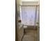 Functional bathroom featuring a vanity, toilet, and a shower/tub combination with a decorative curtain at 1567 Oak Hill Trl, Kissimmee, FL 34747
