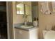 Bathroom featuring a vanity, decorative mirrors, and a tiled floor at 1567 Oak Hill Trl, Kissimmee, FL 34747