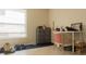 Bedroom with a large window, tiled floors, and desk with a chair in front of it at 1567 Oak Hill Trl, Kissimmee, FL 34747