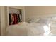 Bedroom with a closet with organized clothing and a white bed frame at 1567 Oak Hill Trl, Kissimmee, FL 34747