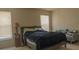 Bedroom featuring a queen-sized bed, soft lighting, and a cozy seating area at 1567 Oak Hill Trl, Kissimmee, FL 34747