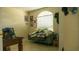 Bedroom with a unique architectural window and decor at 1567 Oak Hill Trl, Kissimmee, FL 34747