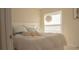 Bright bedroom featuring a modern bed frame, white bedding, and natural light at 1567 Oak Hill Trl, Kissimmee, FL 34747