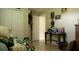 Bedroom with posters, tiled floors, a closet, and a small desk against a beige wall at 1567 Oak Hill Trl, Kissimmee, FL 34747