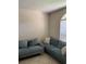 Inviting living area with comfortable couches, tile flooring, and natural light from a window with blinds at 1567 Oak Hill Trl, Kissimmee, FL 34747