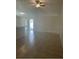 Open floor plan living room with tile flooring and a ceiling fan at 1567 Oak Hill Trl, Kissimmee, FL 34747
