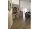 Open-concept living area with tile flooring, a wet bar, and sliding glass doors leading to an outdoor space at 1567 Oak Hill Trl, Kissimmee, FL 34747