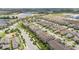 Beautiful aerial view of a suburban neighborhood with homes, green spaces, and water features at 16261 Admirals Cove Ln, Winter Garden, FL 34787