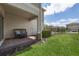 Cozy covered back patio with a small garden and privacy fence at 16261 Admirals Cove Ln, Winter Garden, FL 34787