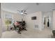 Bright, airy bedroom features neutral paint, a ceiling fan, and a large window with a scenic view at 16261 Admirals Cove Ln, Winter Garden, FL 34787