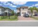 Exterior elevation of home featuring driveway, fenced in yard, and two-car garage at 16261 Admirals Cove Ln, Winter Garden, FL 34787