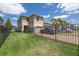 Well-maintained two-story home featuring a fenced yard and brick-paved driveway at 16261 Admirals Cove Ln, Winter Garden, FL 34787