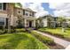 Inviting two-story home with manicured lawn, brick walkway, and charming architectural details at 16261 Admirals Cove Ln, Winter Garden, FL 34787