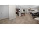 Open-concept living area with a kitchen island, tile flooring, and a view into the living room at 16261 Admirals Cove Ln, Winter Garden, FL 34787