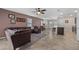 Open concept living and dining area with a kitchen bar and tile flooring at 16261 Admirals Cove Ln, Winter Garden, FL 34787