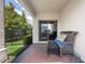 Cozy outdoor patio with comfortable seating and a view of the backyard at 16261 Admirals Cove Ln, Winter Garden, FL 34787
