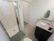 Bathroom featuring granite-topped vanity, shower stall, and grey tile floors at 16274 Taliesin St, Winter Garden, FL 34787