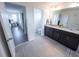 Bathroom featuring a double vanity with granite countertops at 16274 Taliesin St, Winter Garden, FL 34787
