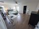 Bright bedroom featuring a ceiling fan, walk-in closet, desk, and wood-look flooring at 16274 Taliesin St, Winter Garden, FL 34787