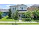 Charming two-story home with landscaped front yard and welcoming entryway at 16274 Taliesin St, Winter Garden, FL 34787