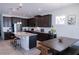 Spacious kitchen featuring dark wood cabinets, granite countertops and stainless steel appliances at 16274 Taliesin St, Winter Garden, FL 34787
