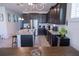 Spacious open kitchen with granite countertops, stainless steel appliances, and breakfast bar at 16274 Taliesin St, Winter Garden, FL 34787