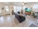 Inviting living room with neutral tones, tile flooring, and plenty of natural light at 16274 Taliesin St, Winter Garden, FL 34787