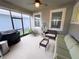 Relaxing screened-in patio with a sofa and seating area at 16274 Taliesin St, Winter Garden, FL 34787