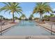 Enjoy the swimming pool, surrounded by palm trees, lounge chairs, and beautiful views at 16274 Taliesin St, Winter Garden, FL 34787