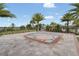 Community splash pad area with seating, lush landscaping, and decorative fountain on a sunny day at 16274 Taliesin St, Winter Garden, FL 34787